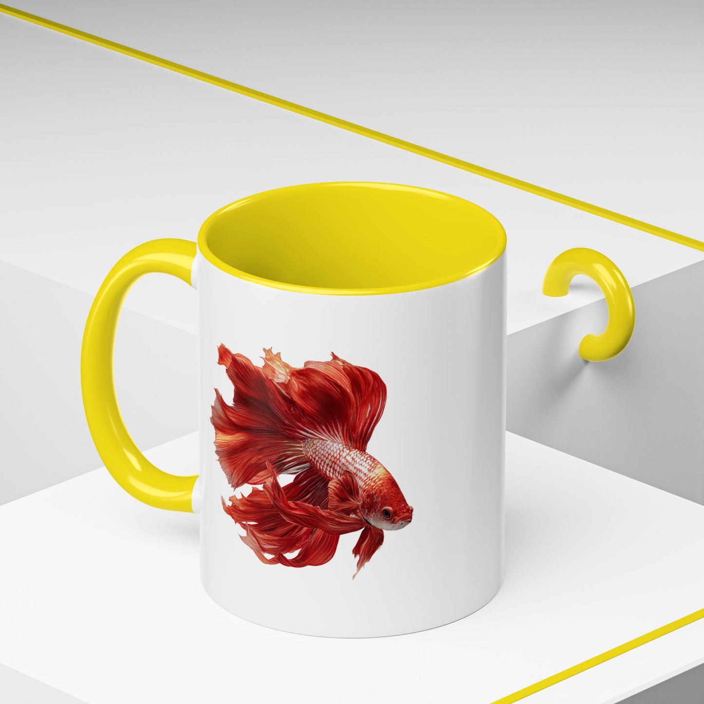 White mug with yellow interior and handle featuring a red and gold fighting fish design on a white background
