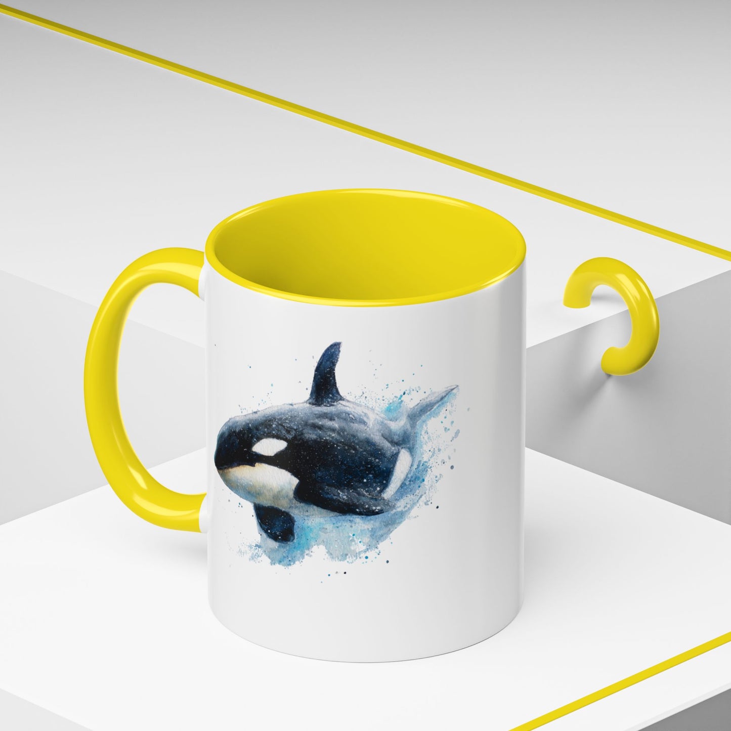 Mug with yellow interior and handle featuring an orca whale design on a white background