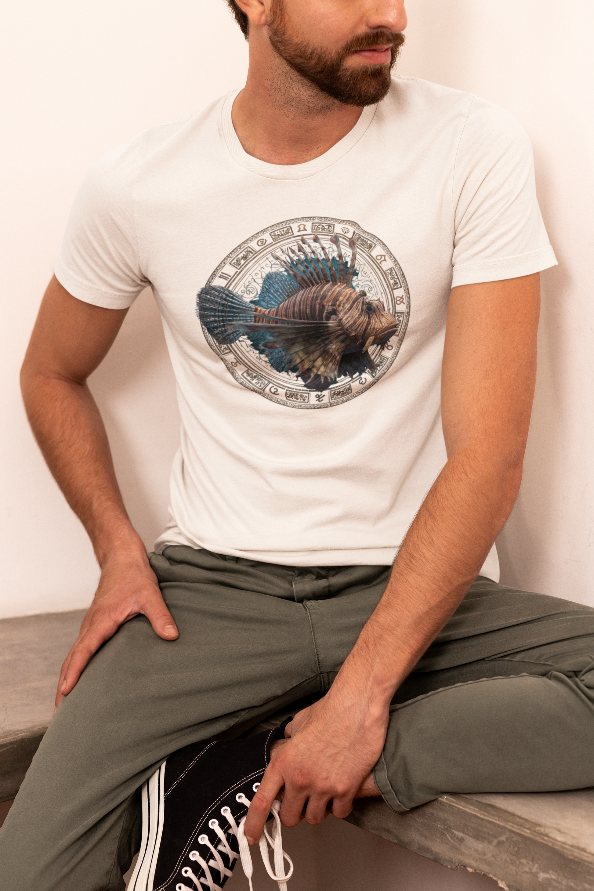 Leo man wearing a white t-shirt with a fish zodiac sign