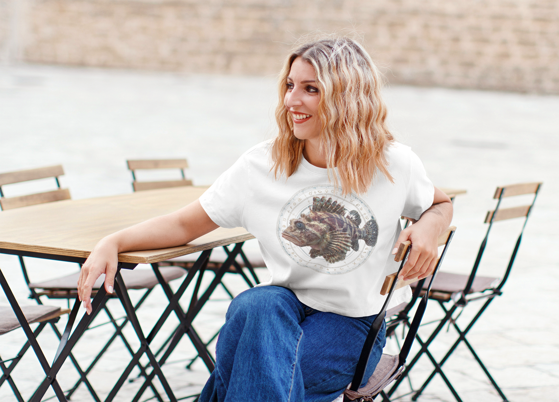 Scorpio woman wearing a white t-shirt with a fish zodiac sign