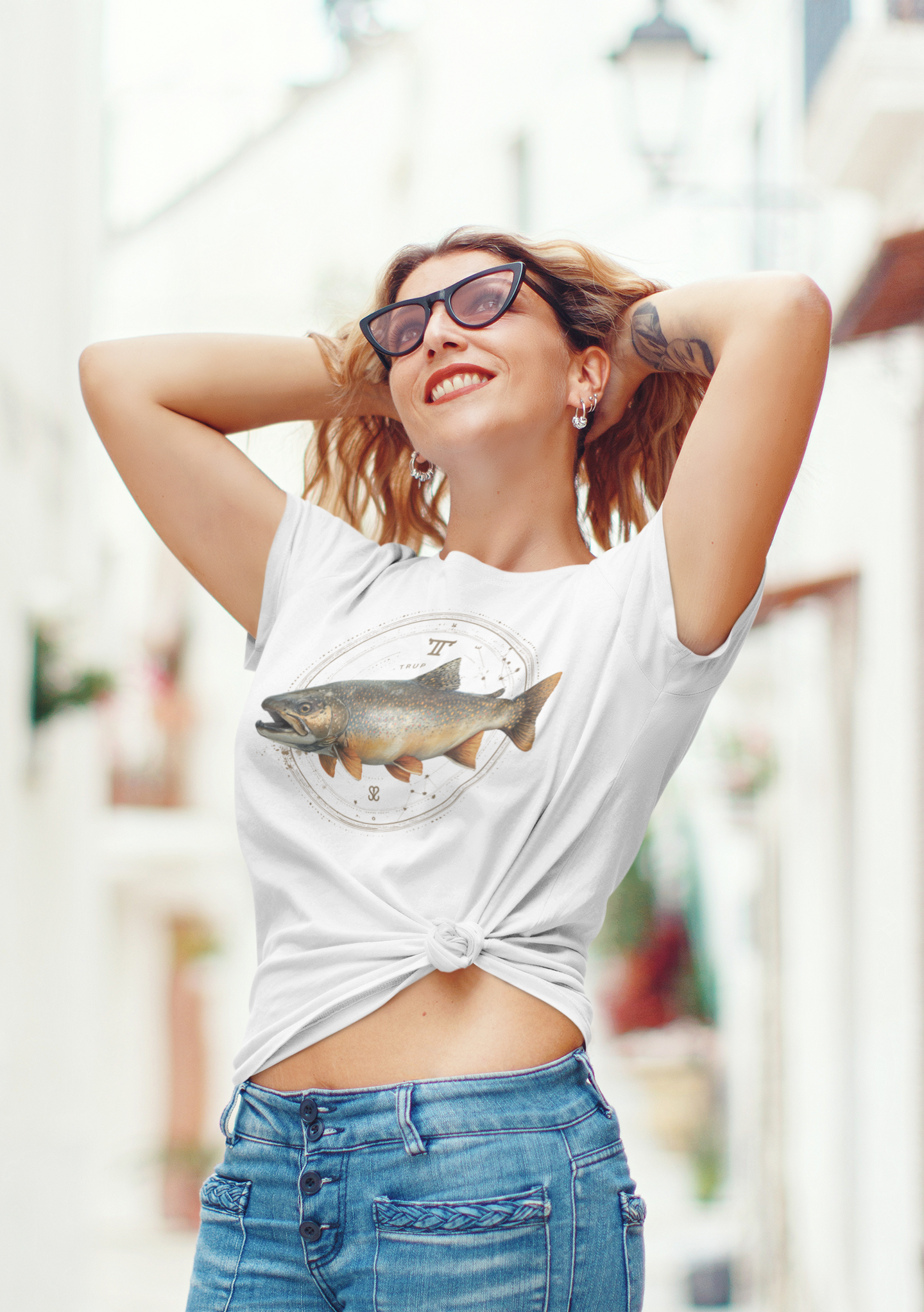 Taurus woman wearing a white t-shirt with a fish zodiac sign
