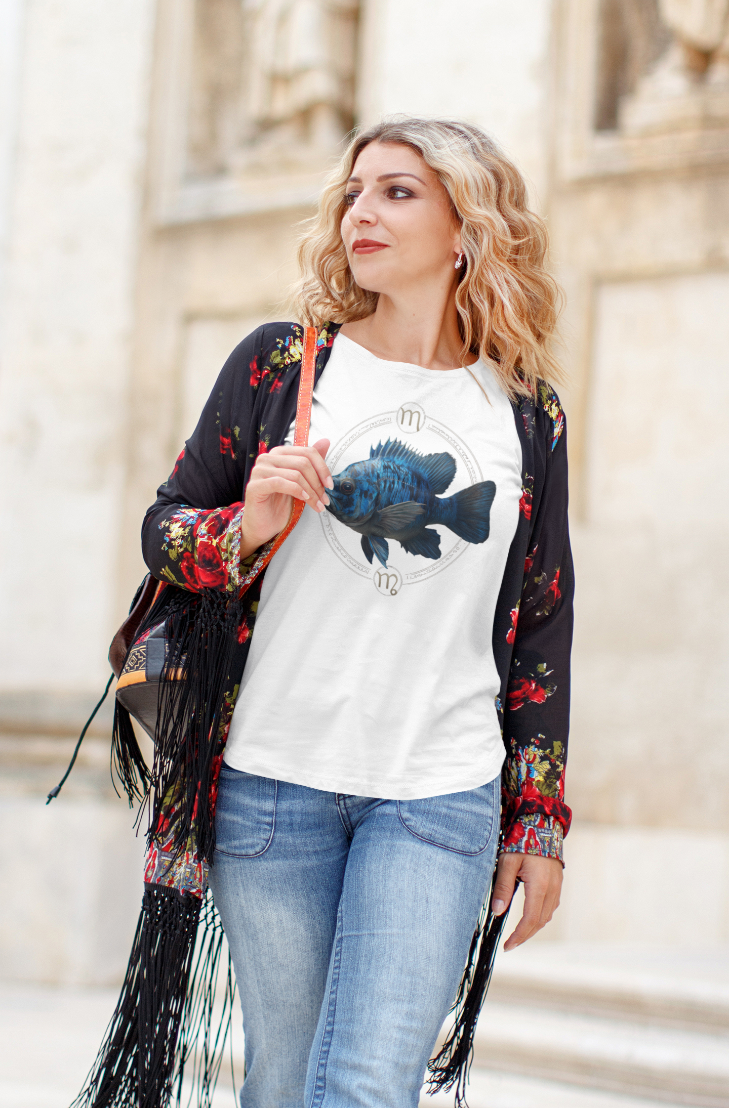 Virgo woman wearing a white t-shirt with a fish zodiac sign